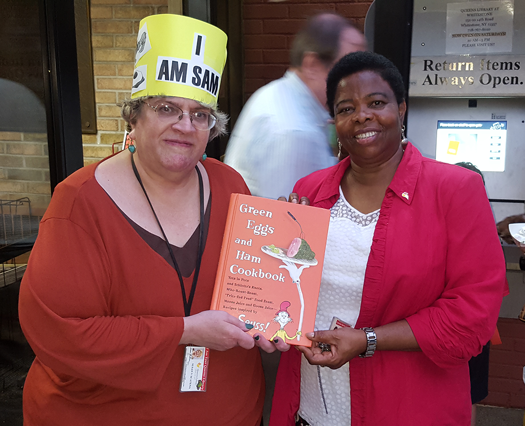 Susan Scatena with Whitestone Library manager Nonyem Iloabachie in 2016.