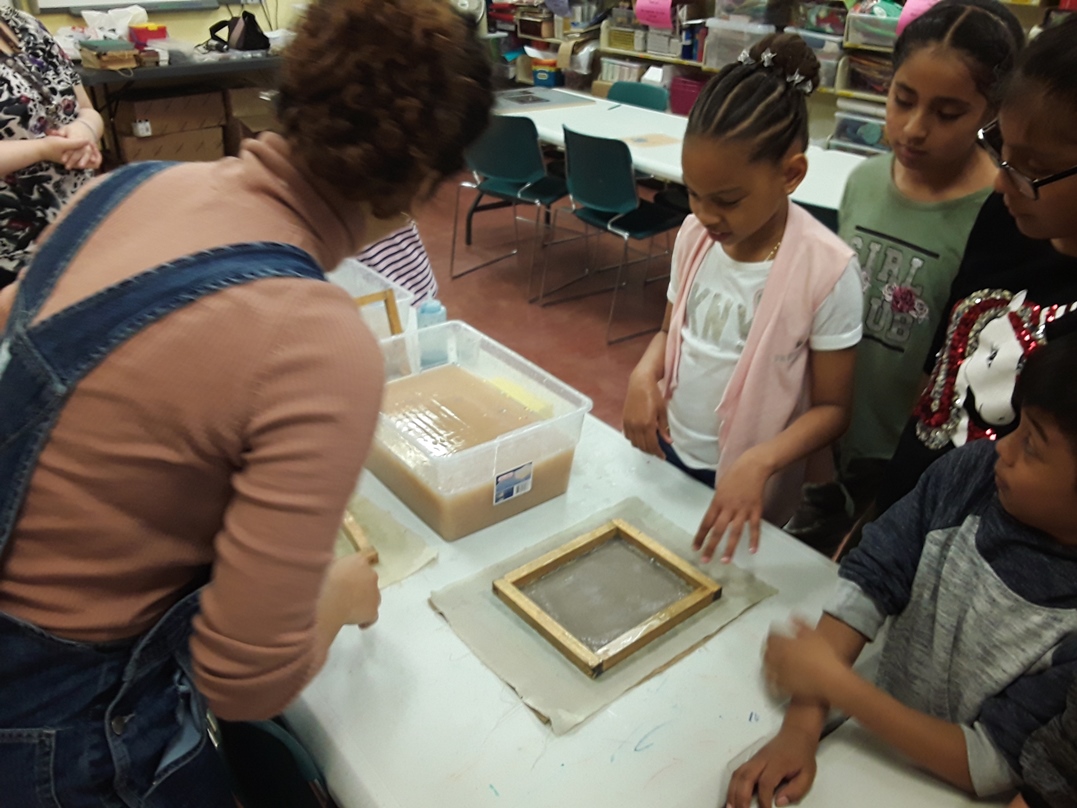 Kids make paper by hand in Week 3 of our Book Creation Workshop.