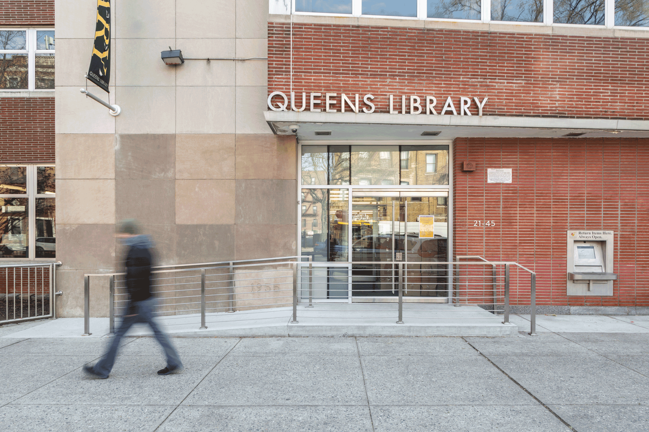 Steinway Library’s main entrance on 31st Street features a new ADA accessible ramped entrance and a 24/7 exterior book returns machine.